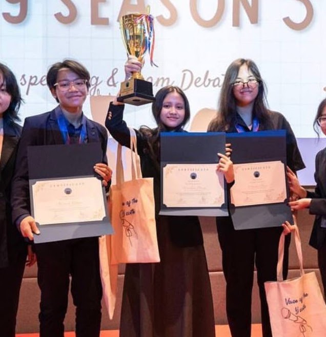 Seasonal competition winners holding their certificates
