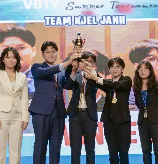 VOTY Summer Tournament team celebrating on stage